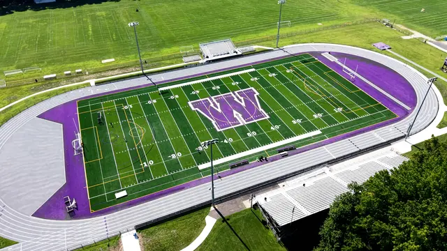 Aerial view of the synthetic turf field and surrounding running track at Cherry Hill West