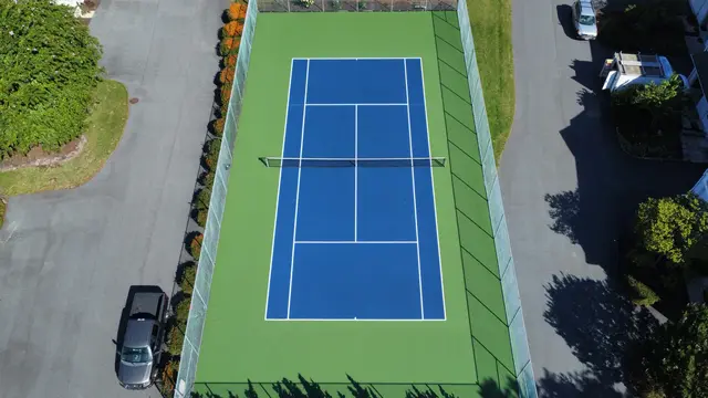 Overhead view of the Schooner Village tennis court and surrounding fencing