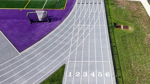 Numbered starting lanes and white lane markings on the resurfaced Cherry Hill West track